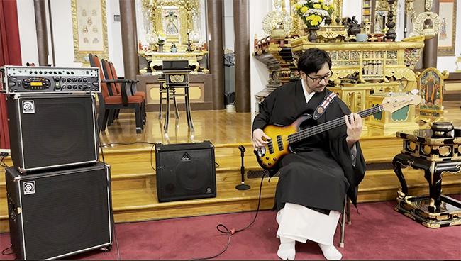 Rev. Yuki Sugahara strums along with Dharma messages